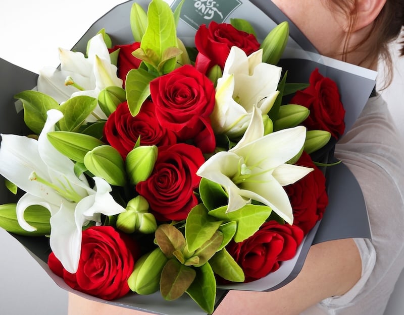 Red roses mixed with lilies for beloved wife's birthday